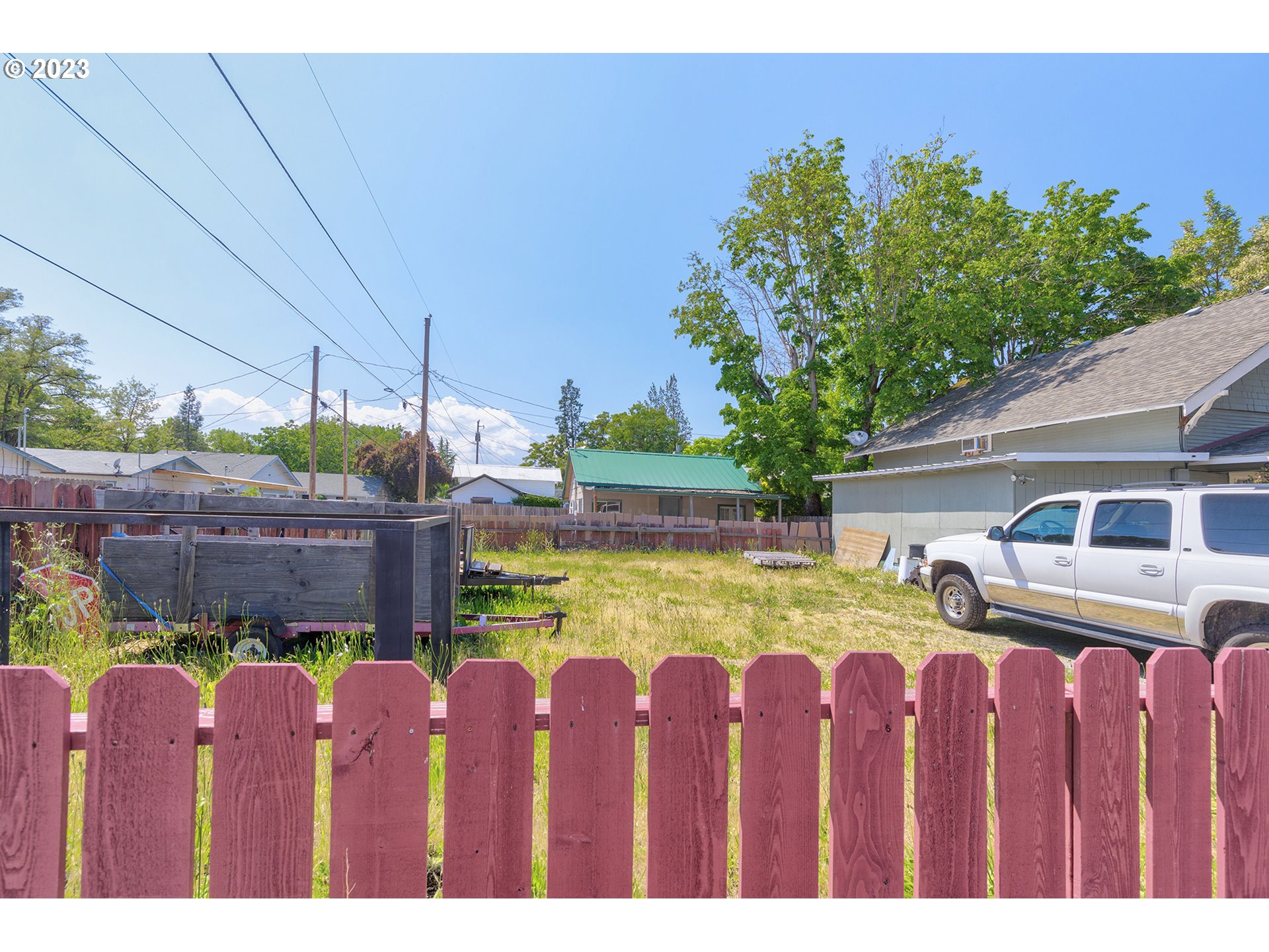 302 Southwest Pine Street Grants Pass, OR 97526 - Photo 6 of 20 a view of a yard with wooden fence