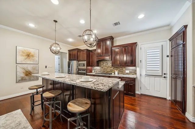 a kitchen with a table and chairs in it