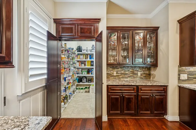 a kitchen with stainless steel appliances granite countertop a stove and a refrigerator