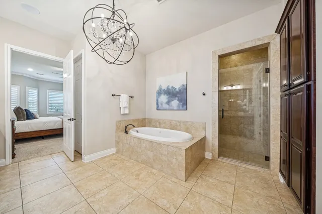 a spacious bathroom with a shower and a sink