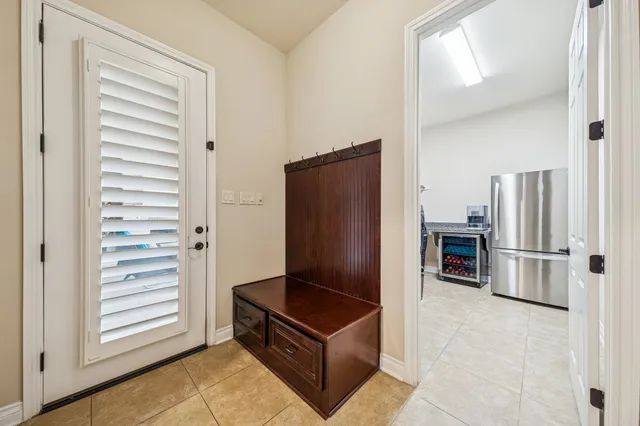 a kitchen with a refrigerator and microwave