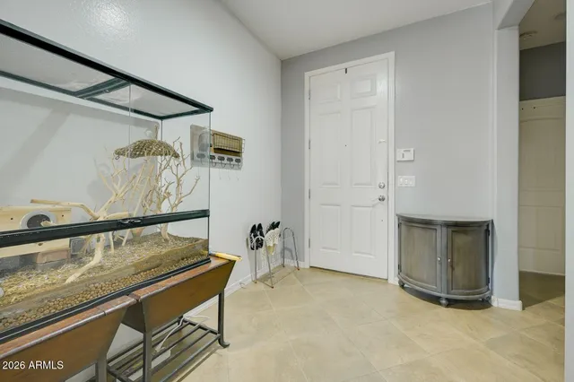 a bedroom with bed and window