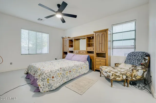 a bedroom with a bed and furniture