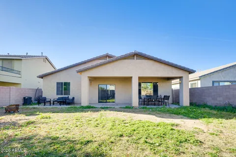 a view of a car park in front of a house