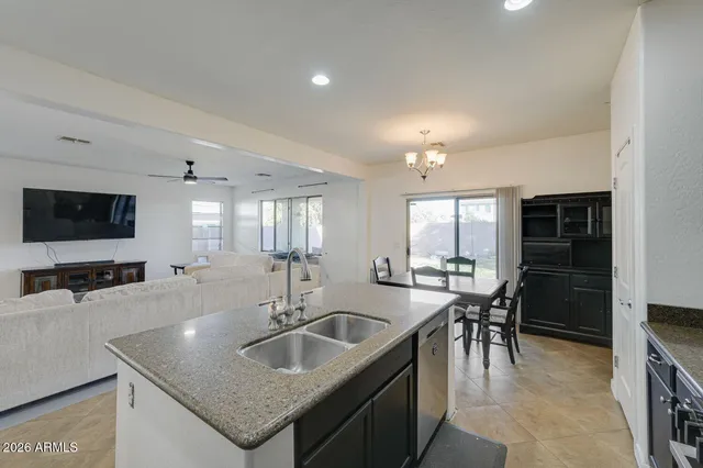 a kitchen with counter top space sink and stainless steel appliances