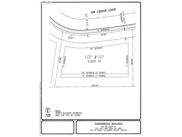 a view of a golf course with a large trees
