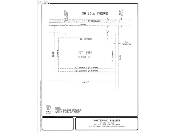 a view of a swimming pool with a yard and trees
