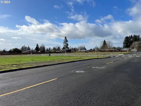 a view of a golf course with a lake