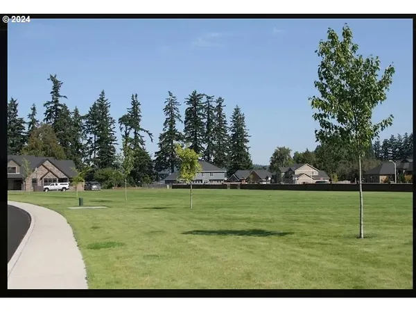 a view of a golf course with a road
