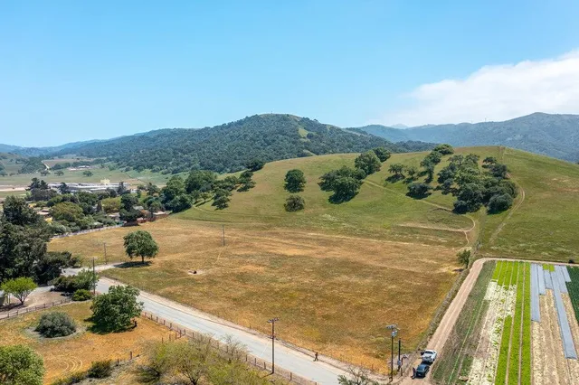 a view of a swimming pool with a yard
