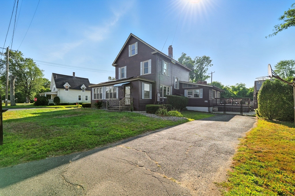 138 Suffield Street Agawam, MA 01001 - Photo 1 of 42 a house with garden in front of it