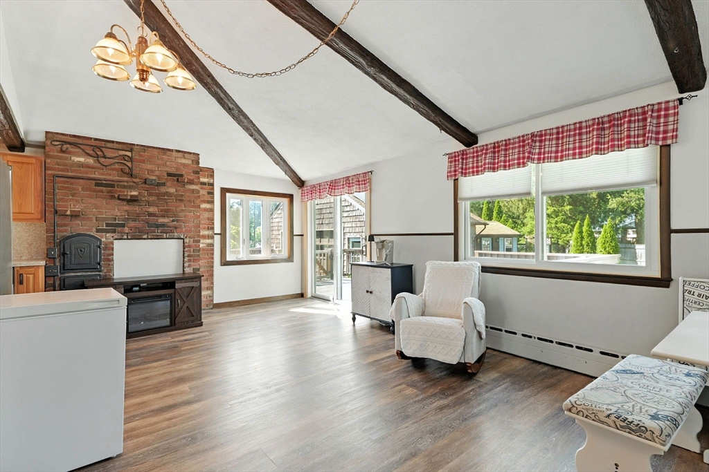 138 Suffield Street Agawam, MA 01001 - Photo 14 of 42 a living room with furniture and a fireplace