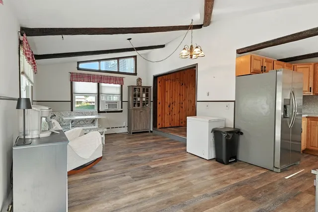a kitchen with a refrigerator and a sink