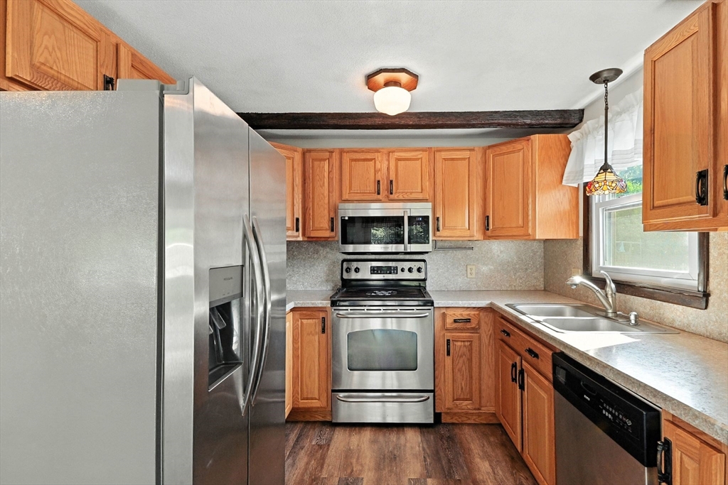 138 Suffield Street Agawam, MA 01001 - Photo 17 of 42 a kitchen with a sink appliances and cabinets