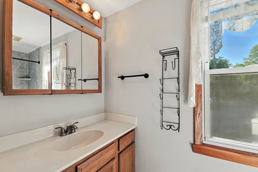 138 Suffield Street Agawam, MA 01001 - Photo 20 of 42 a bathroom with a sink and a mirror