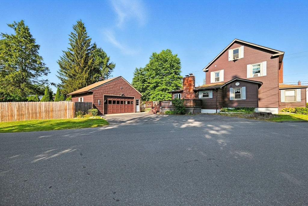138 Suffield Street Agawam, MA 01001 - Photo 2 of 42 a front view of a house with a yard and garage