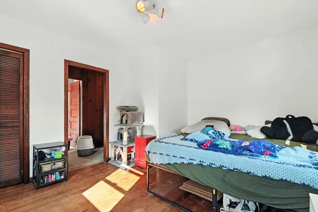 a bedroom with a bed and a dresser