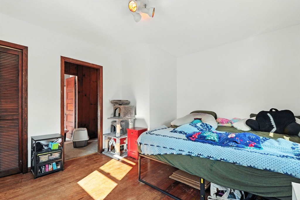 138 Suffield Street Agawam, MA 01001 - Photo 27 of 42 a bedroom with a bed and a dresser