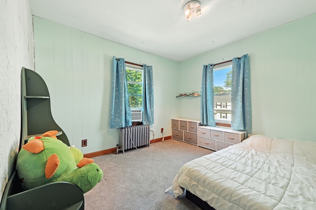 138 Suffield Street Agawam, MA 01001 - Photo 29 of 42 a bedroom with a bed and window