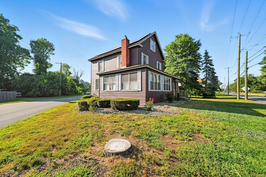 138 Suffield Street Agawam, MA 01001 - Photo 3 of 42 a house view with swimming pool garden and trees
