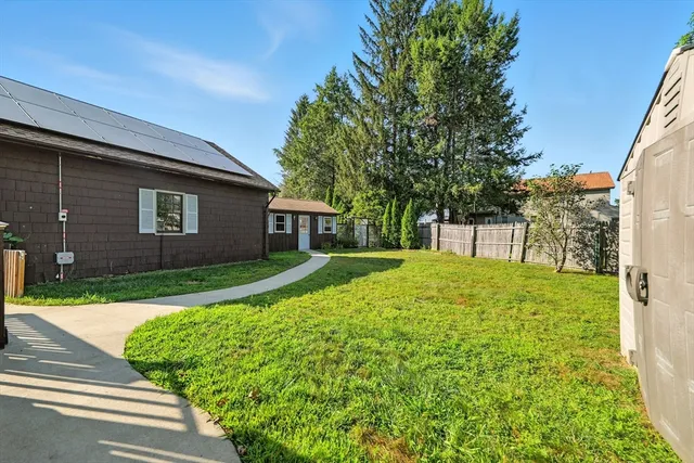 a view of a house with a yard