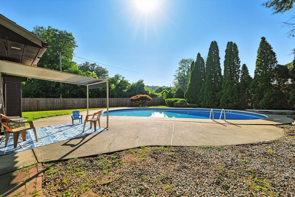 138 Suffield Street Agawam, MA 01001 - Photo 38 of 42 a view of a swimming pool with a yard and sitting area