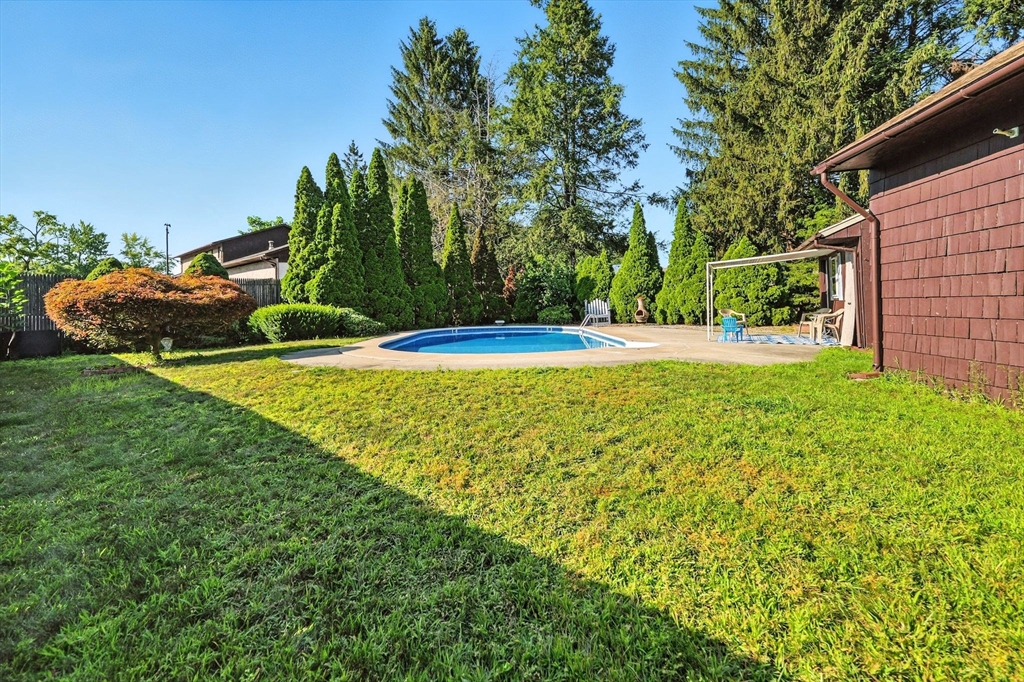 138 Suffield Street Agawam, MA 01001 - Photo 40 of 42 a view of a swimming pool with a yard