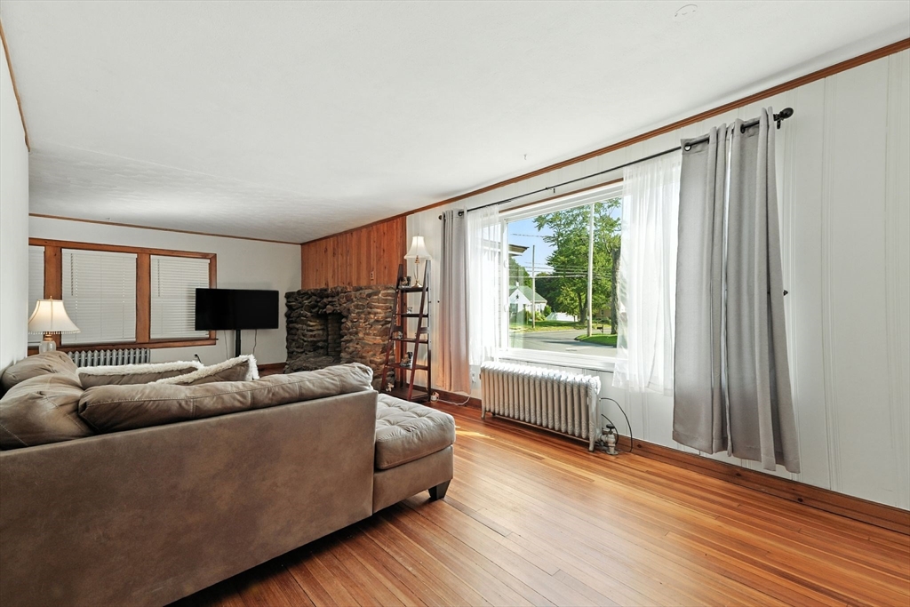 138 Suffield Street Agawam, MA 01001 - Photo 10 of 42 a living room with furniture and a large window