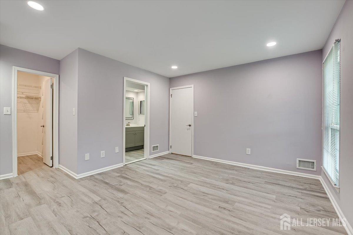 706 Maplecrest Road Edison, NJ 08820 - Photo 22 of 34 wooden floor in an empty room with a window