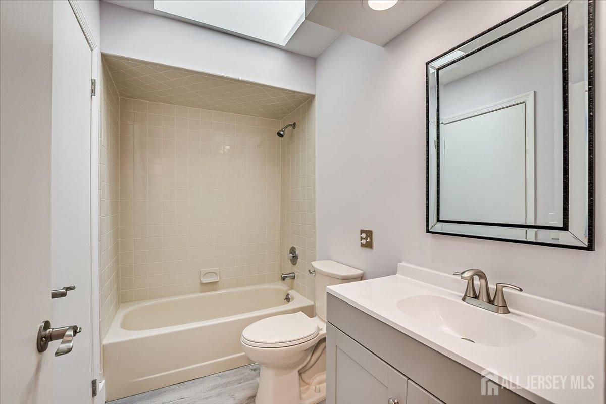 706 Maplecrest Road Edison, NJ 08820 - Photo 24 of 34 a bathroom with a toilet a sink and bathtub