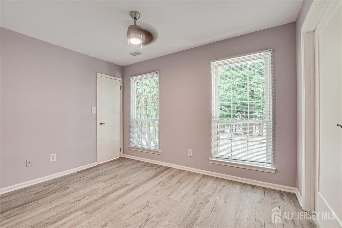 706 Maplecrest Road Edison, NJ 08820 - Photo 25 of 34 wooden floor in an empty room with a window