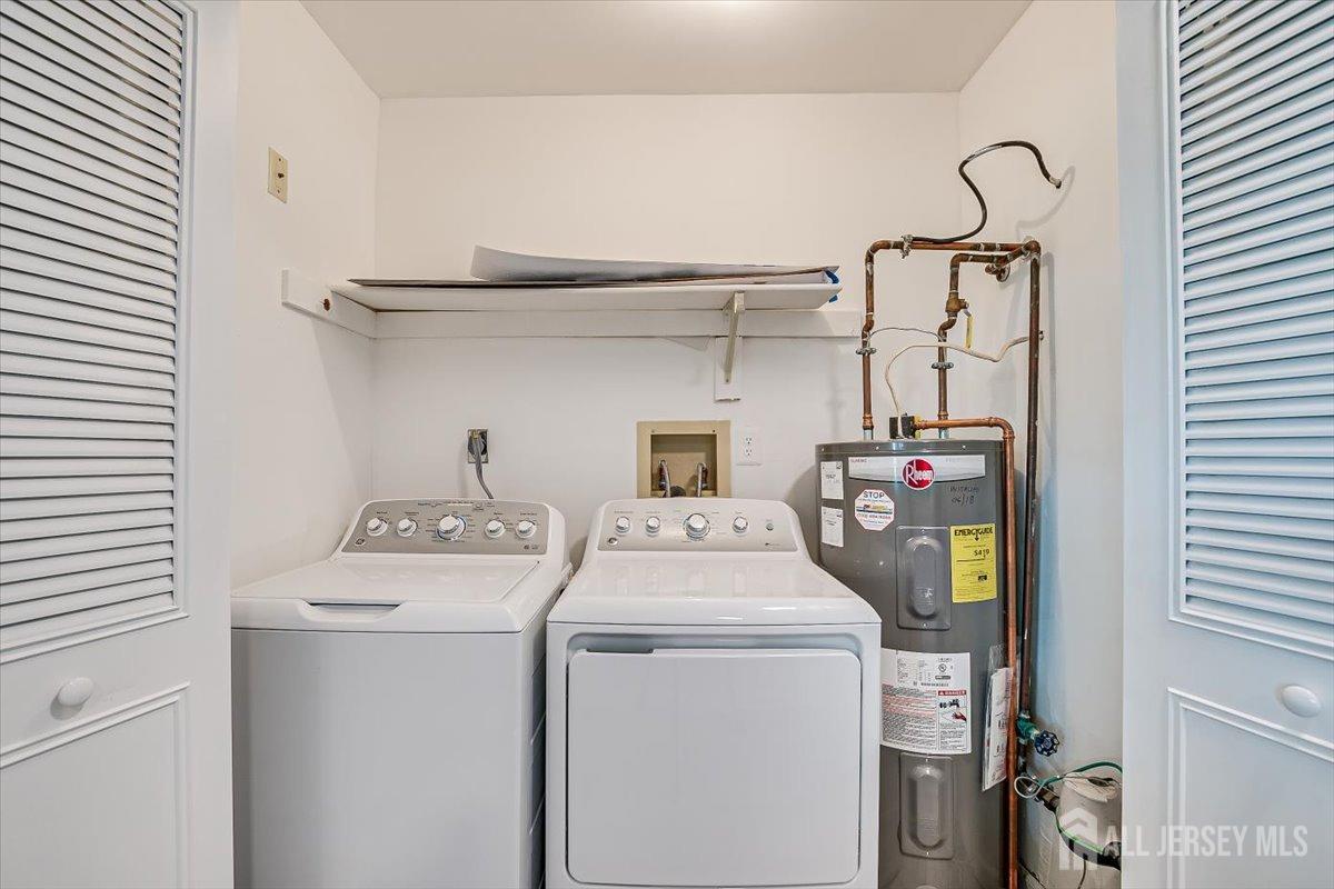 706 Maplecrest Road Edison, NJ 08820 - Photo 27 of 34 a utility room with dryer and washer