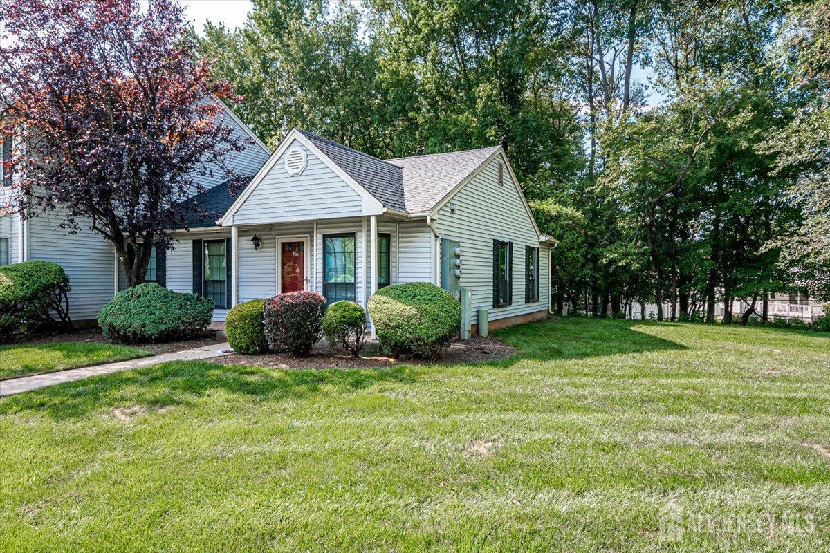 706 Maplecrest Road Edison, NJ 08820 - Photo 3 of 34 a front view of a house with a yard and trees