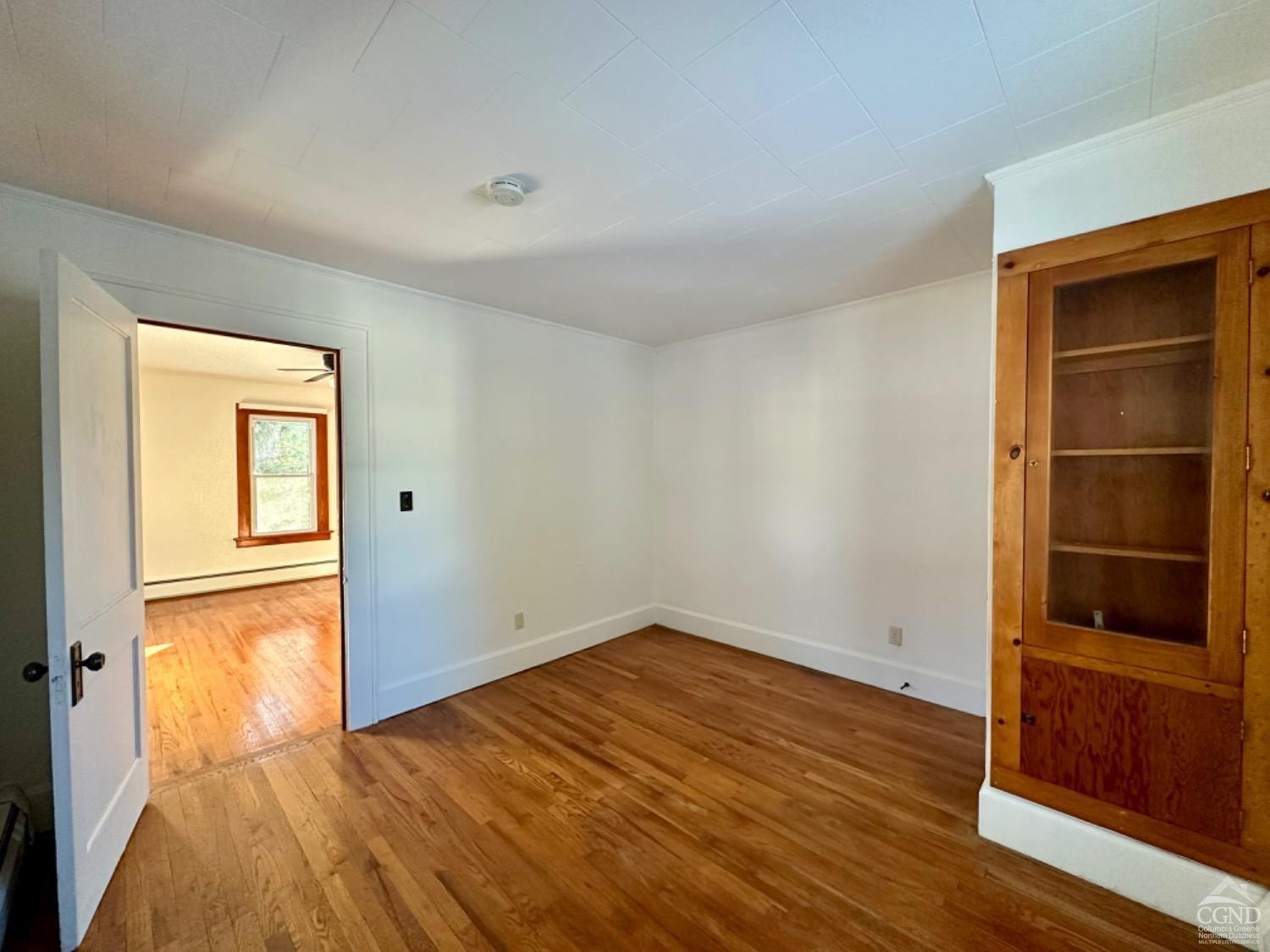 20 Eagle Street, Unit 2 Claverack, NY 12529 - Photo 11 of 20 an empty room with wooden floor and closet