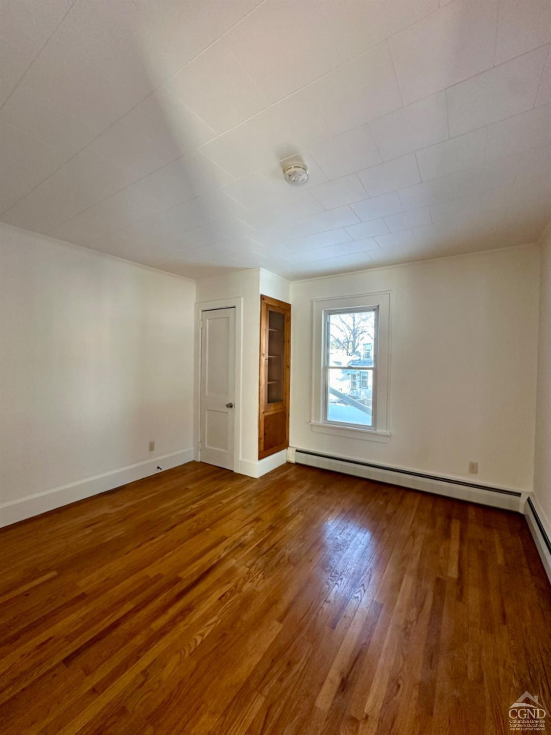 20 Eagle Street, Unit 2 Claverack, NY 12529 - Photo 12 of 20 a view of an empty room with wooden floor and window