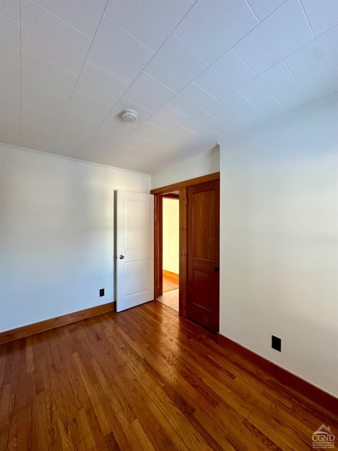 20 Eagle Street, Unit 2 Claverack, NY 12529 - Photo 15 of 20 a view of an empty room with wooden floor and window
