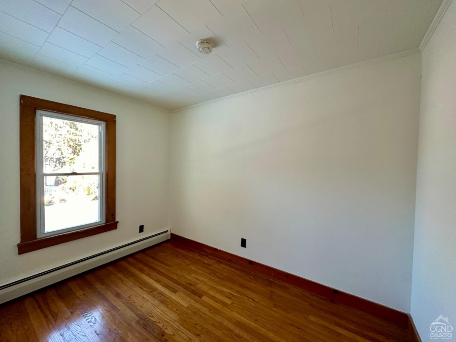 20 Eagle Street, Unit 2 Claverack, NY 12529 - Photo 16 of 20 an empty room with wooden floor and windows
