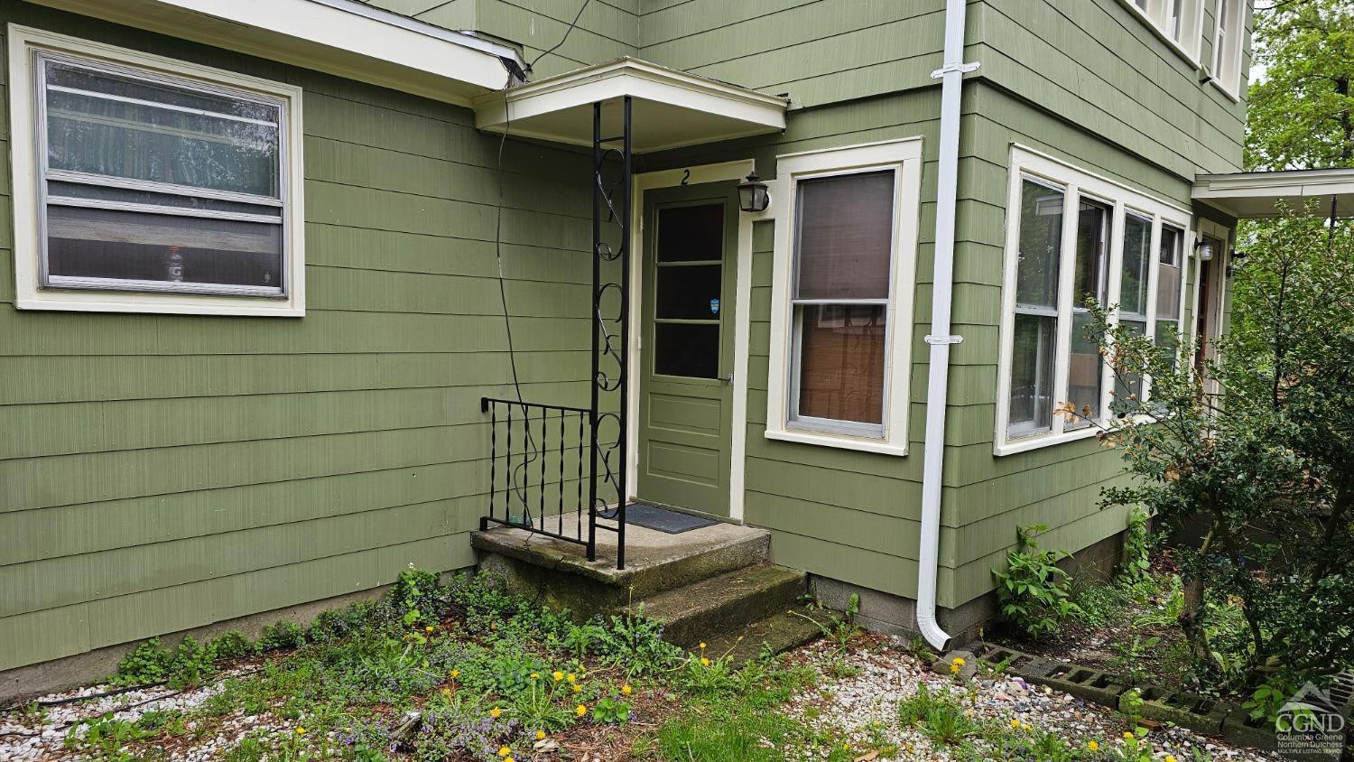 20 Eagle Street, Unit 2 Claverack, NY 12529 - Photo 17 of 20 a front view of a house with a garden
