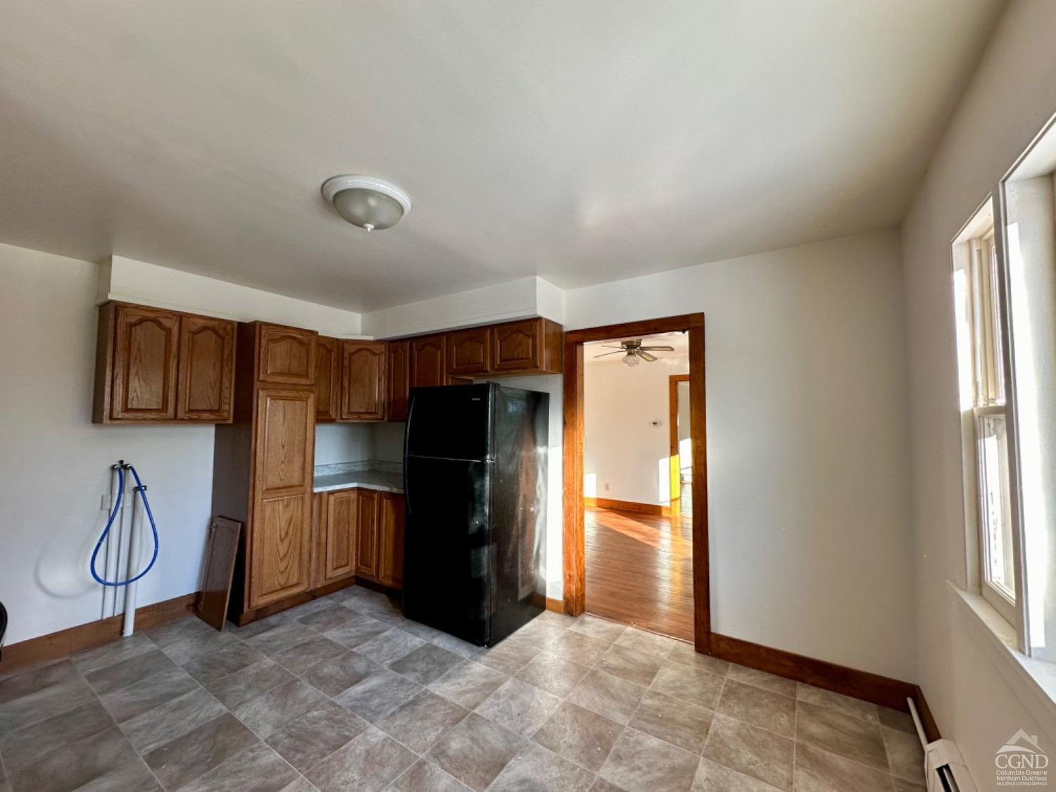 20 Eagle Street, Unit 2 Claverack, NY 12529 - Photo 4 of 20 a view of kitchen with windows and refrigerator