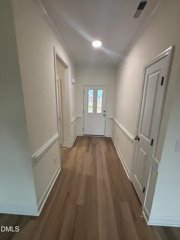 a view of a room with wooden floor and staircase