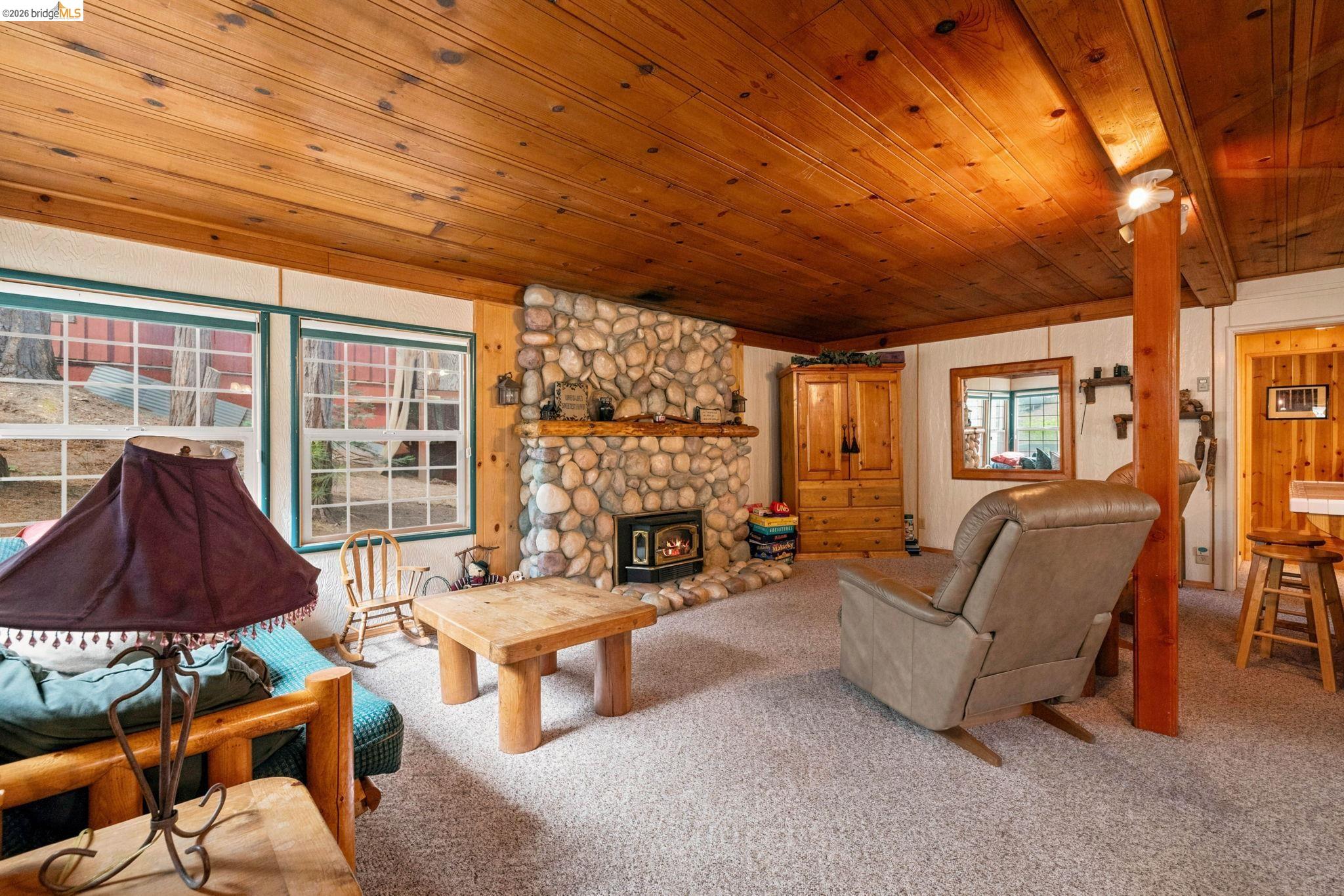 25822 Long Barn Sugar Pine Road Long Barn, CA 95335 - Photo 6 of 28 a living room with furniture and a large window