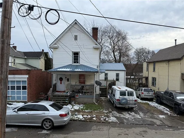 a car parked in front of a house