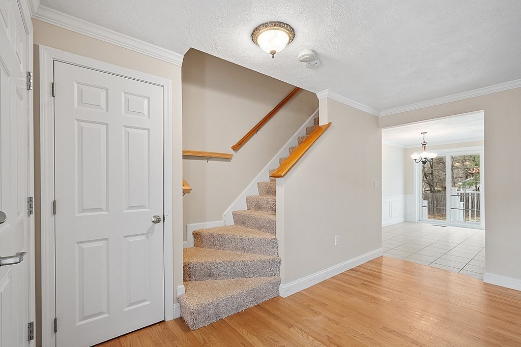 34 Lowell Road, Unit 4 Pepperell, MA 01463 - Photo 12 of 21 a view of an entryway with wooden floor and staircase