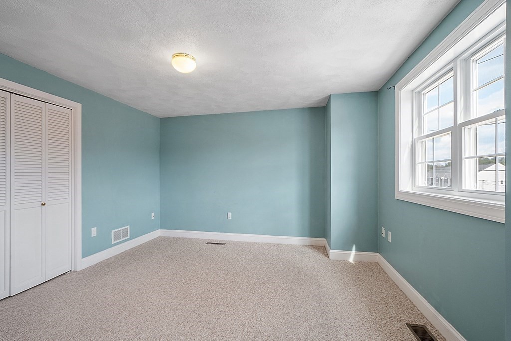 34 Lowell Road, Unit 4 Pepperell, MA 01463 - Photo 13 of 21 a view of an empty room with a window
