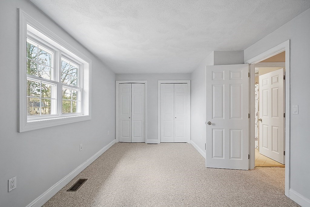 34 Lowell Road, Unit 4 Pepperell, MA 01463 - Photo 15 of 21 a view of an empty room with a window