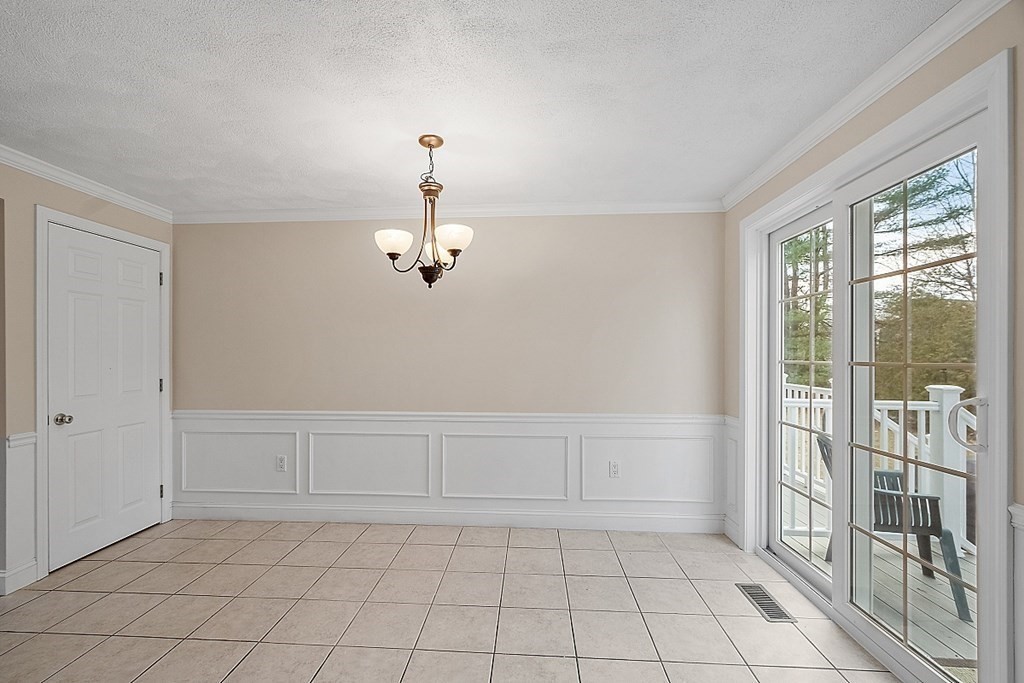 34 Lowell Road, Unit 4 Pepperell, MA 01463 - Photo 8 of 21 a view of a livingroom with an empty space and a window