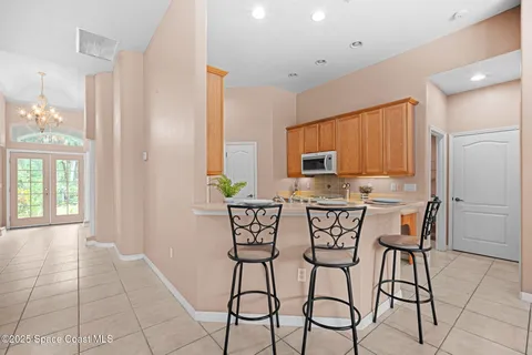 a view of a dining room with furniture and a window