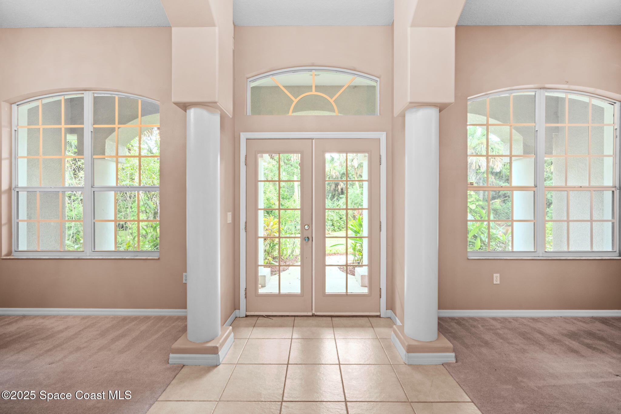 7635 Windover Way Titusville, FL 32780 - Photo 5 of 36 an empty room with a window