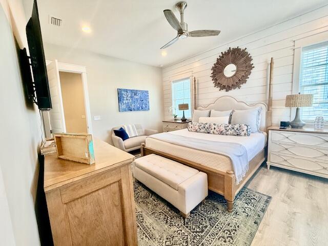 166 Cabana Trail Santa Rosa Beach, FL 32459 - Photo 11 of 23 a bedroom with a bed a flat screen tv and a large window