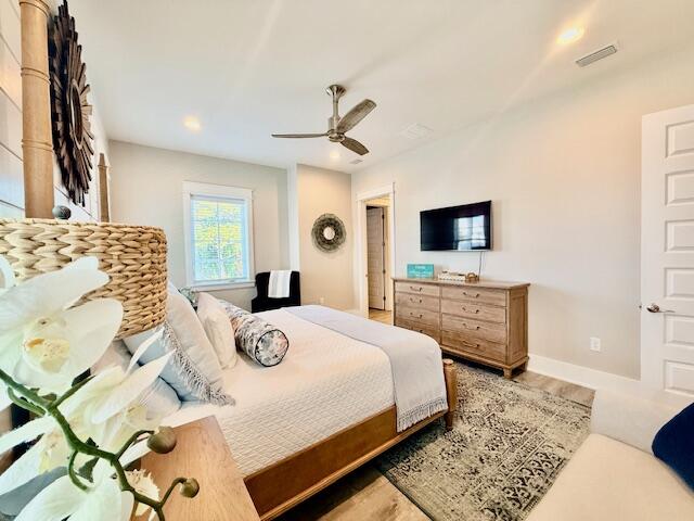 166 Cabana Trail Santa Rosa Beach, FL 32459 - Photo 14 of 23 a bedroom with a bed and a flat screen tv